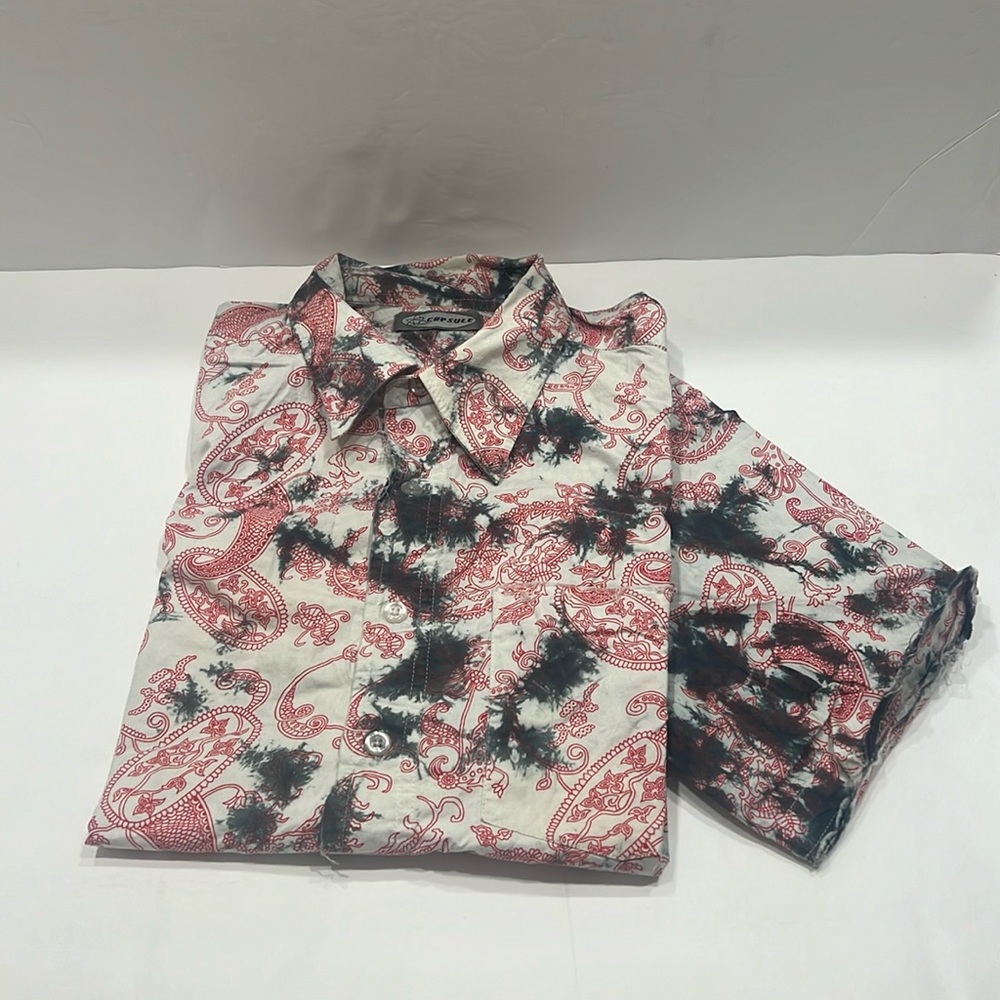Capsule cool, bohemian tie-dye shirt, frail endings, meant to be that way.
